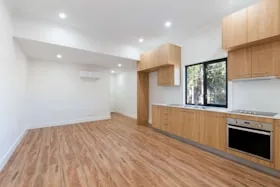 Warm brown wood floor in an open living space