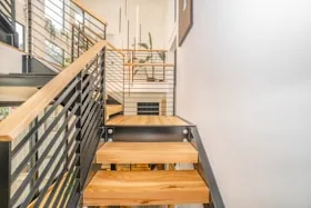 Wood stair treads with a steel railing